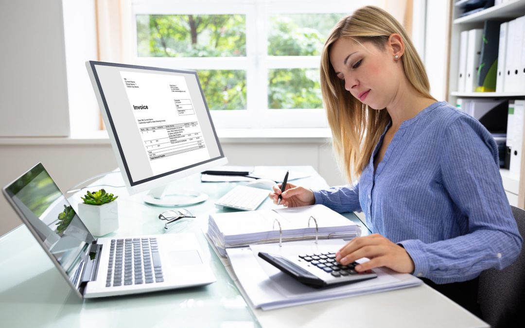 Young businesswoman with calculator, laptop. To illustrate online tax calculator.