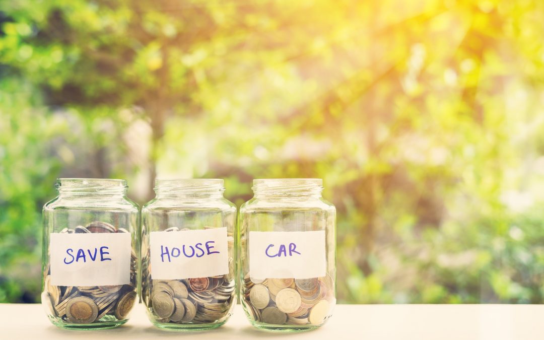 Money in jars marked "save, house" and "car" to illustrate personal money mistakes to avoid.