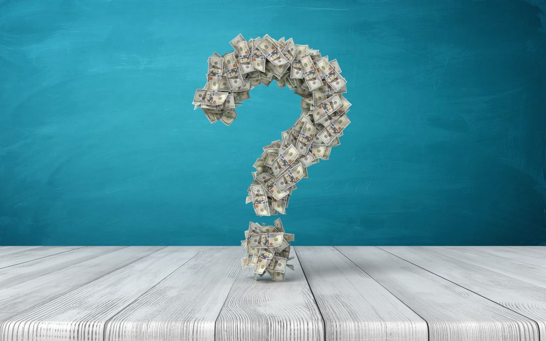 3d art: A question mark made of paper money floats over a table to illustrate the financial question annuity vs. ira